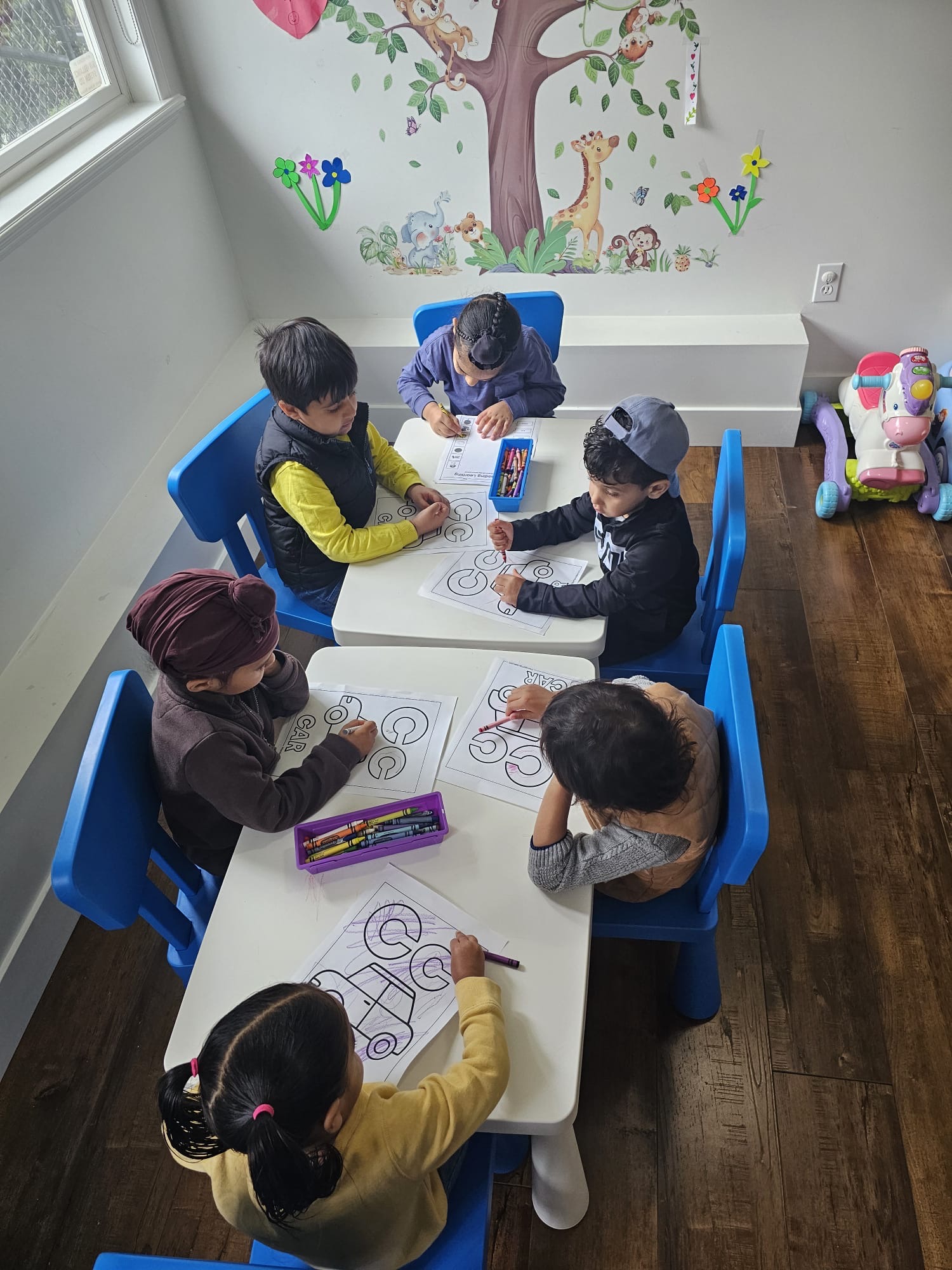 Children coloring at the table